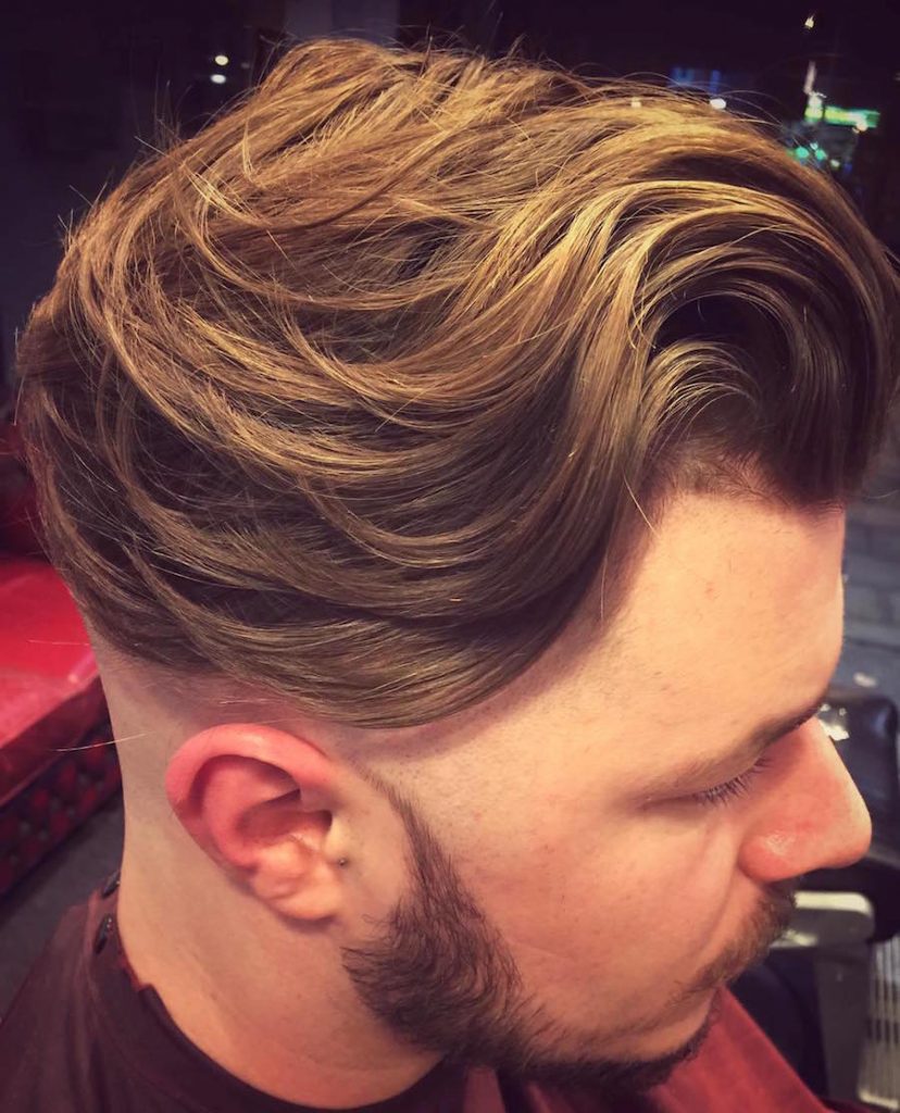 Undercut hairstyle for men with long natural flow